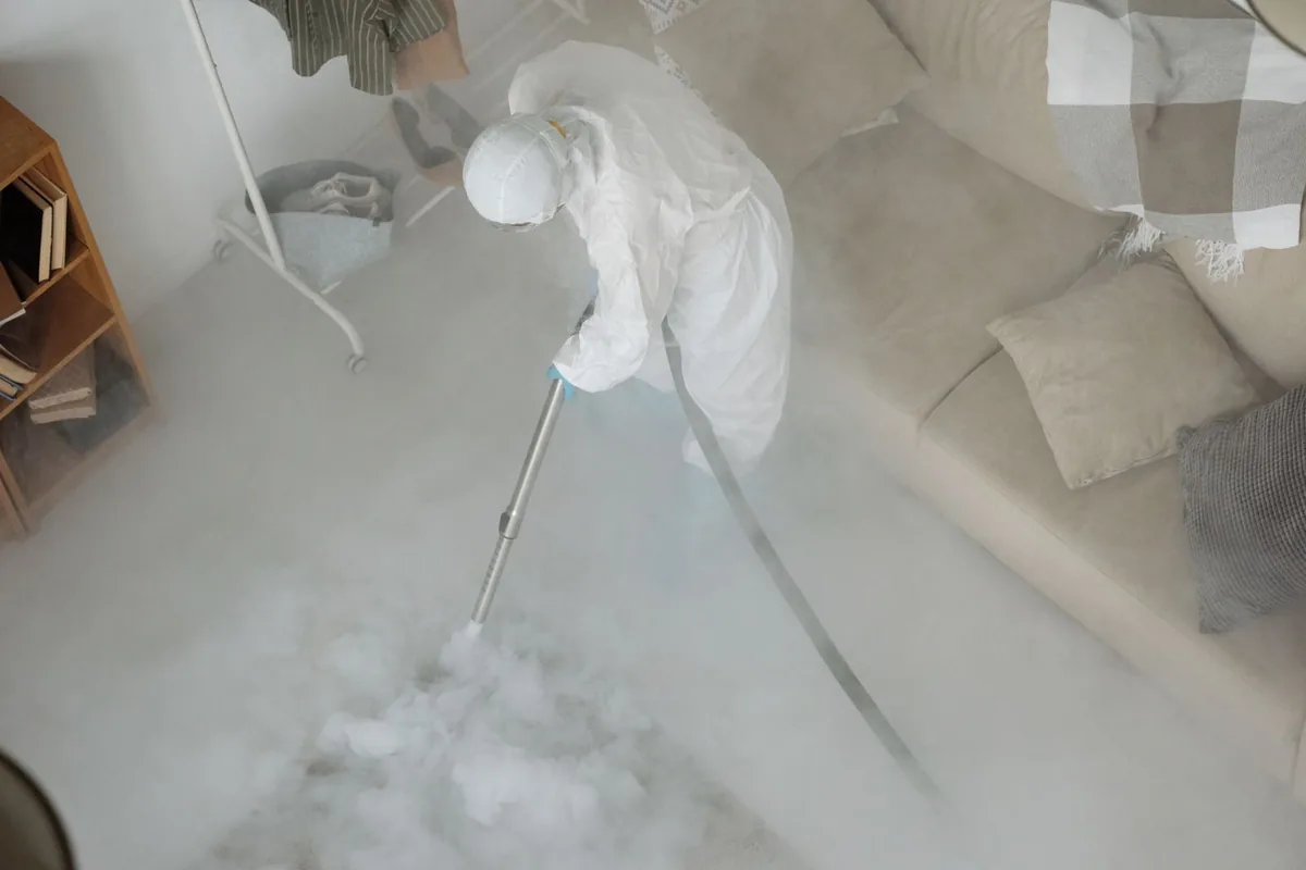 Biohazard cleanup technician in protective equipment, Latimer, MS
